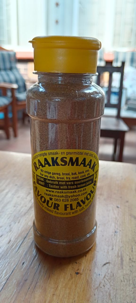 Raaksmaak bottle on a table